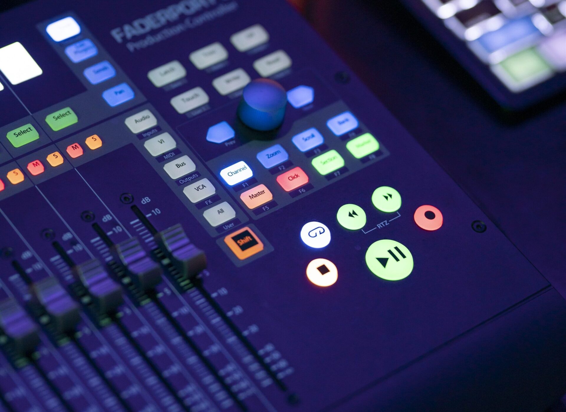 A recording console with a lot of buttons on it.