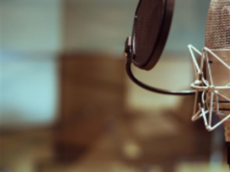 A podcasting microphone in a recording studio.
