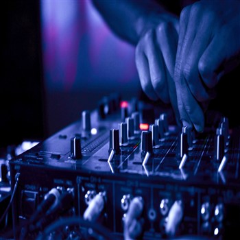 The hands of a dj mixing on a high-quality dj mixer, creating an amazing music experience.