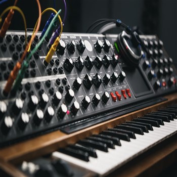 Synthesizer in Orb Music Studio's professional studio with assistance from experienced music engineers.