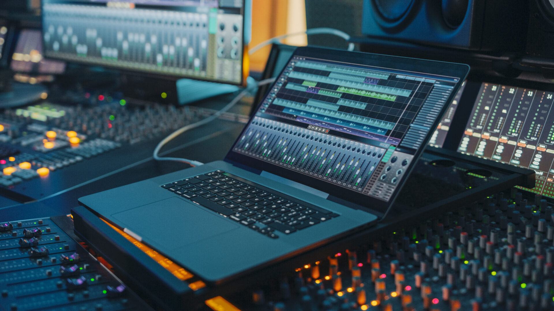 A laptop on a desk in a recording studio during Experience Days.