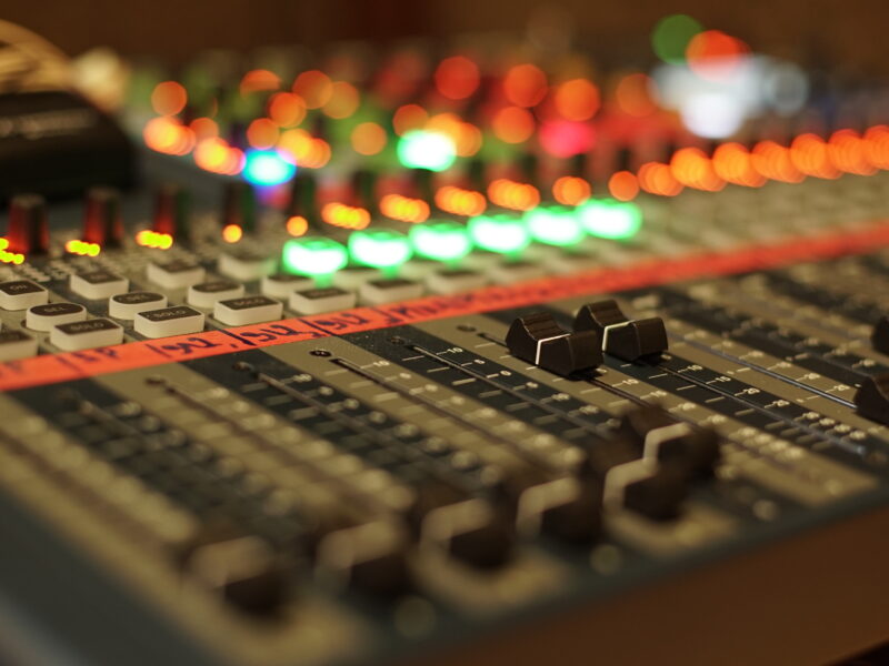 A close up of an audio mixing board at an Experience Day event.